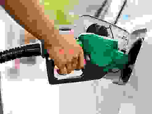 A person putting fuel in a car